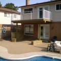 Second floor deck with glass panel barrier