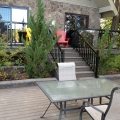 Deck and stairs with black aluminum railing, pickets and glass (built with Trex Decking)