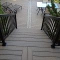 Deck and stairs with black aluminum railing, pickets and glass (built with Trex Decking)