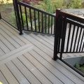 Deck and stairs with black aluminum railing, pickets and glass (built with Trex Decking)
