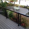 Deck and stairs with black aluminum railing, pickets and glass (built with Trex Decking)