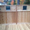 Cedar floating deck, railing and privacy wall with stained glass insterts