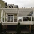 Large deck with pergola custom colour match to composite Trex railing with glass and baluster