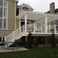 Large deck with pergola custom colour match to composite Trex railing with glass and baluster