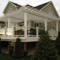 Large deck with pergola custom colour match to composite Trex railing with glass and baluster