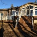 Trex Clip System Decking with wide baluster white railing and glass