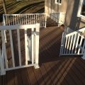 Trex Clip System Decking with wide baluster white railing and glass