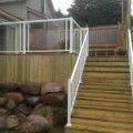 Pressure-treated deck with Regal glass railing with picket