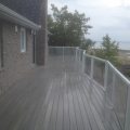 Large composite deck with Regal picket and glass railing