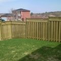 Board on board fence with lattice top on incline using capped 4x4 posts