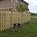 Board on board fence with lattice top on incline using capped 5x5 posts