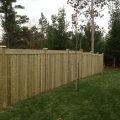 6-foot board and batten style fence with 2x6 top, 5x5 posts