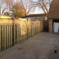 Board on board fence with lattice top on incline using capped 6x6 posts