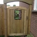 Specialty gate with insert and archway